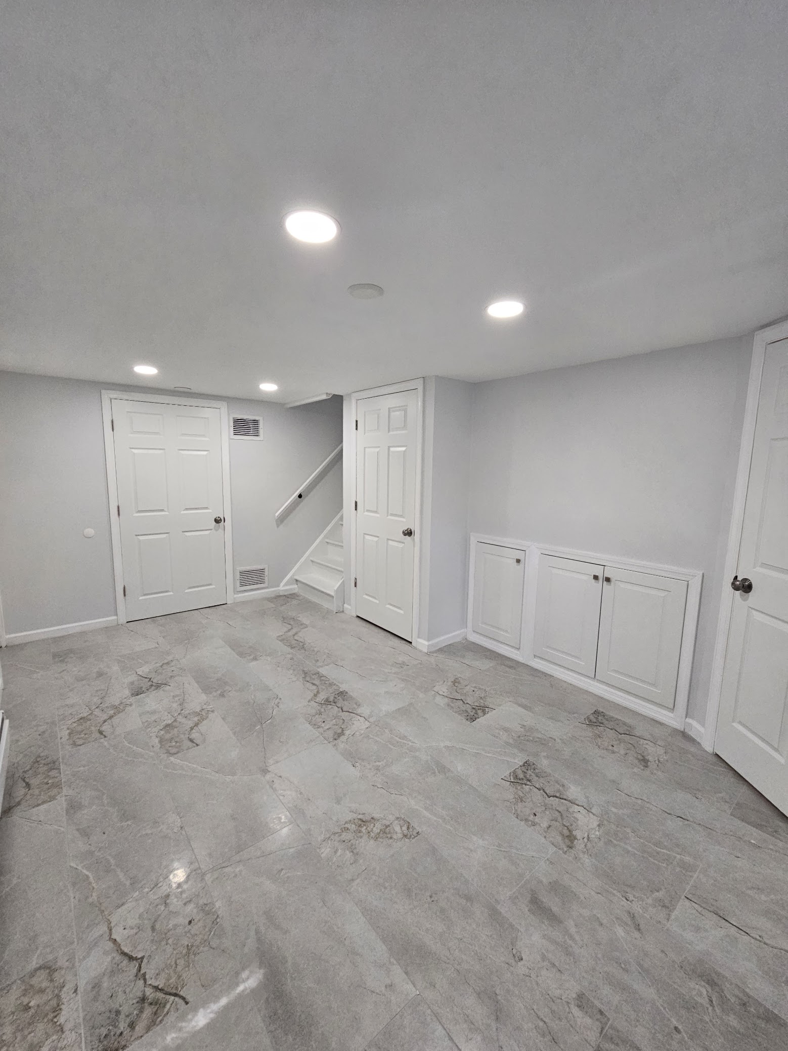 Basement remodel with new finishes by MeyMax Construction LLC