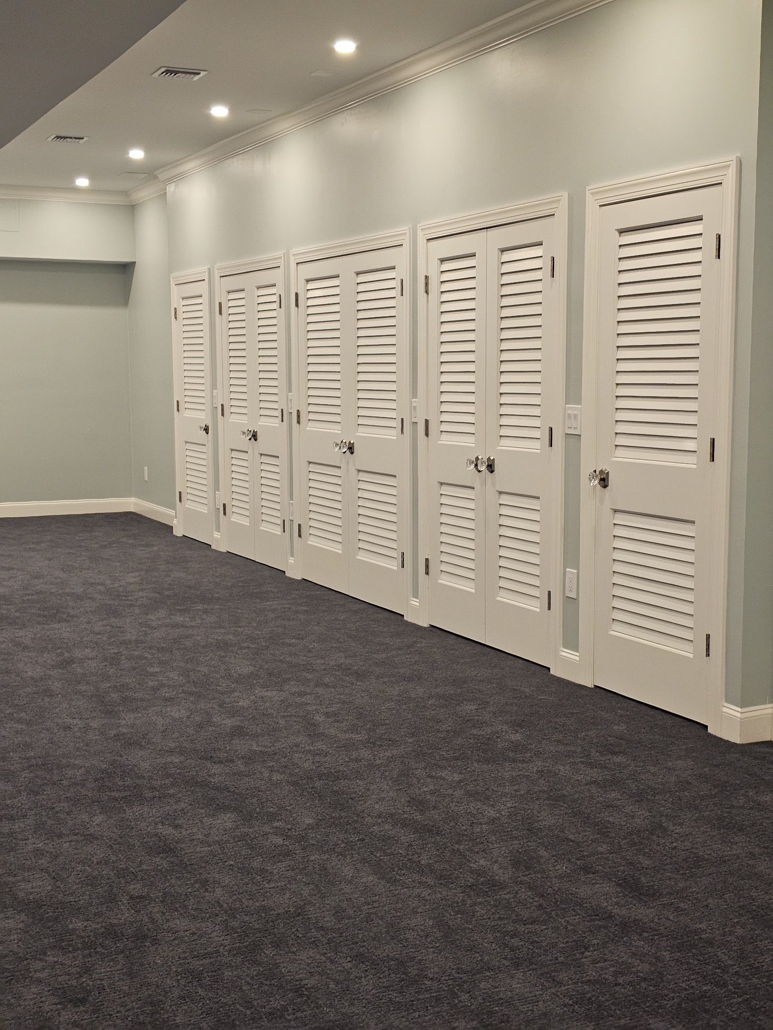 Basement living space by MeyMax Construction LLC