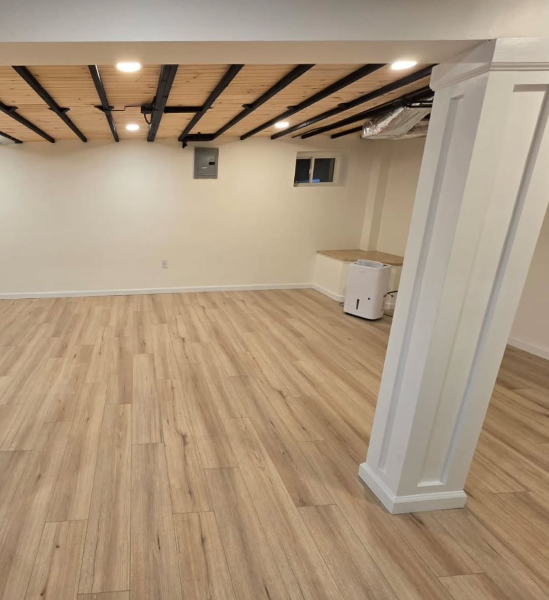 Finished basement space by MeyMax Construction LLC